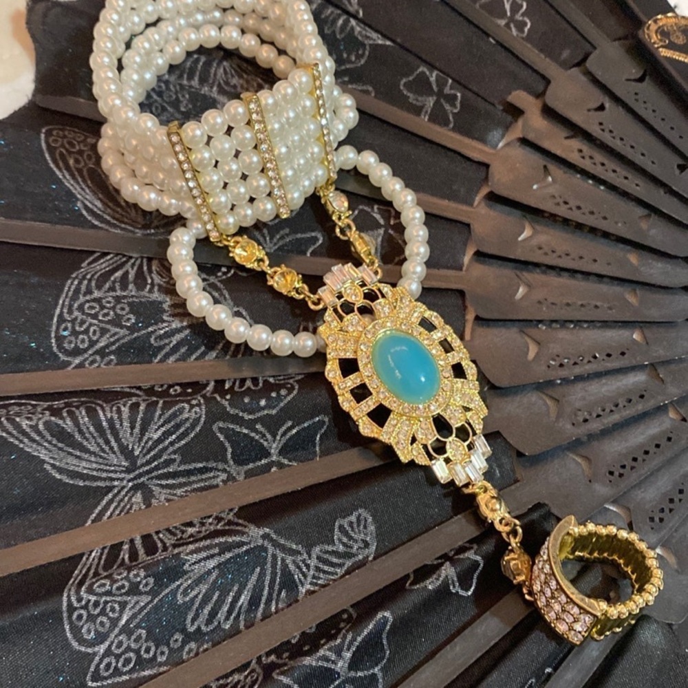 Hand bracelet with ring